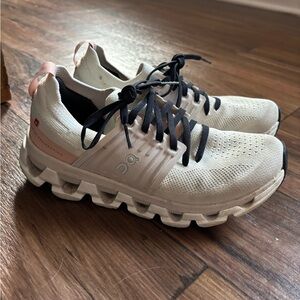 On Running Women's Cream and Black Athletic Shoes